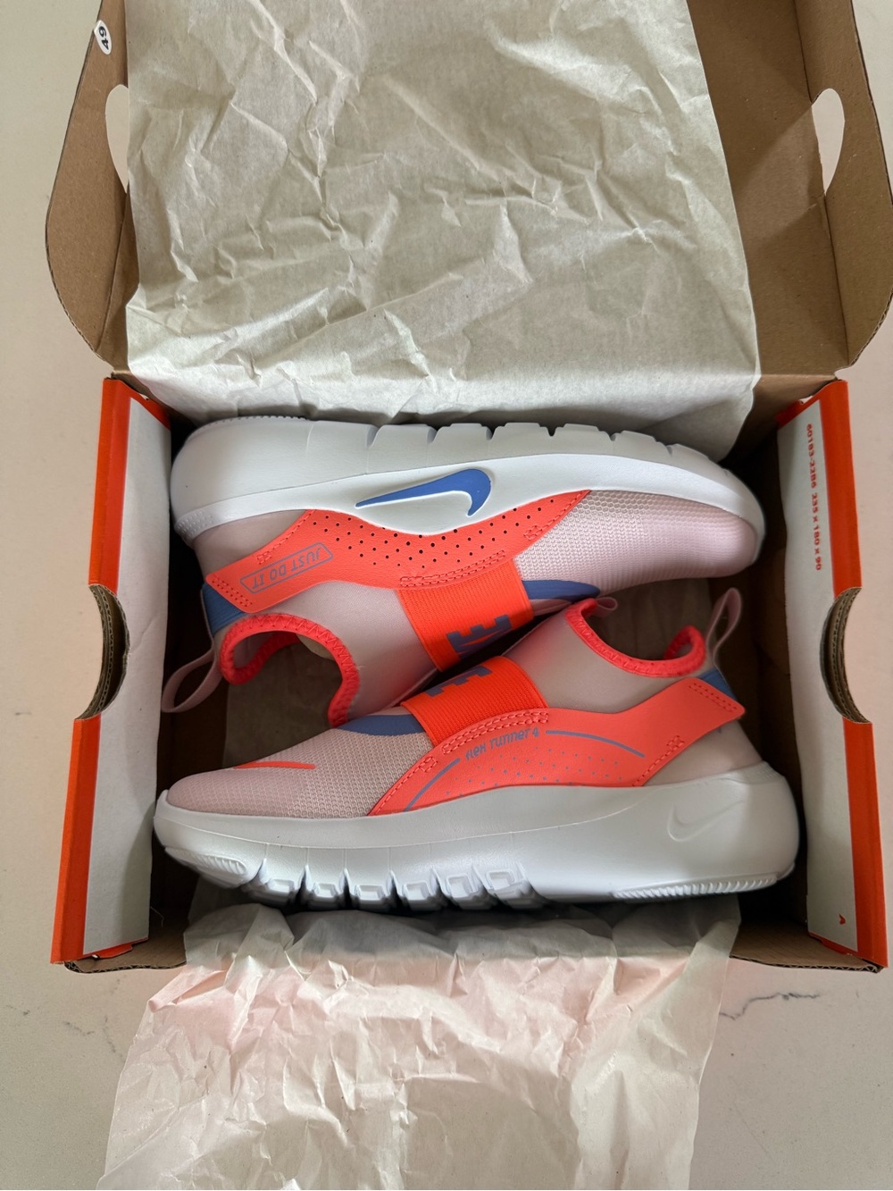 Nike Kids Coral & White Slip-On Sneakers with Blue Swoosh new